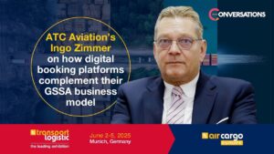 Executive portrait with aviation conference graphic