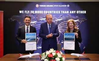 Three executives holding Turkish Airlines certificates