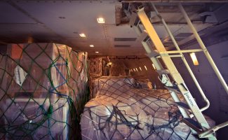 The American made Boeing 747-400 "Jumbo Jet" features a modern EFIS (Electronic Flight Information System) flight deck and a lot of automation, which allows companies around the world to crew this aircraft with two pilots only. 
The freighter variant of the B747 is able to carry 114 metric tons over a distance of 4000 nautical miles.