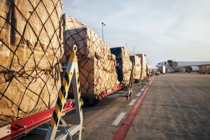 Loading,Of,Cargo,Containers,To,Airplane,At,Airport.